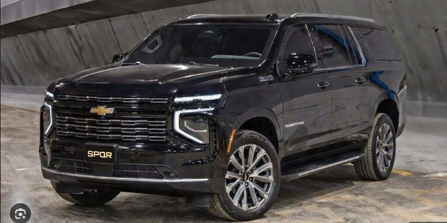 Black SPQR armored SUV with an SPQR front plate inside a secure vehicle facility